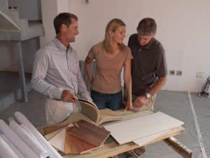 Interior designer talking with couple